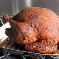 a roasted turkey sitting on top of an oven rack