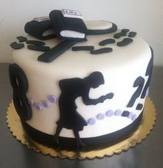 a cake decorated with black and white designs