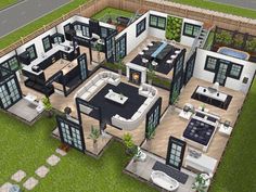 an aerial view of a modern house with lots of windows and furniture in the yard