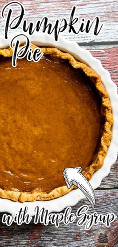 a pumpkin pie sitting on top of a wooden table with the words pumpkin pie above it