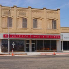 an empty street in front of a store