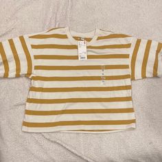 Mustard And White Striped Tee. Never Worn With Tags! Says Xs Bur Could Fit Up To A Medium. Uniqlo White Cotton Tops, Uniqlo Cotton Long Sleeve Tops, Uniqlo Long Sleeve Cotton Top, Uniqlo Cotton Summer Tops, Uniqlo Cotton Casual Tops, Uniqlo Cotton Tops For Summer, Uniqlo Summer Cotton Tops, Summer Uniqlo Cotton Tops, Uniqlo Relaxed Fit Crew Neck Top