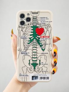 a person holding up a phone case with a skeleton and heart on the back cover