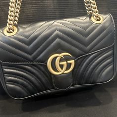 The Small Gg Marmont Camera Bag Has A Softly Structured Shape And A Flap Closure With Double G Hardware. The Sliding Chain Strap Can Be Worn Multiple Ways, Changing Between A Shoulder And A Top Handle Bag. Gucci Black Bag, Gg Marmont, Gucci Black, Gucci Bags, Black Bag, Handle Bag, Chain Strap, Gucci Bag, Top Handle