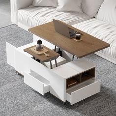 a coffee table with a laptop on it