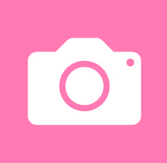 a camera with a pink background and white circle on the top, in front of it