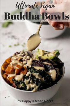 a bowl filled with vegetables and dressing being drizzled on top of it