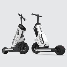 two electric scooters side by side on a white background, one is black and the other is white