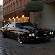 a black muscle car parked on the street