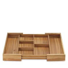 a wooden tray with compartments on it