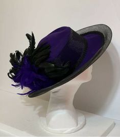 STUNNING VINTAGE Ellie  PURPLE HAT with BLACK FEATHERS 100% Wool Condition: EXCELLENT Black Brimmed Hat For Costume, Black Short Brim Hat For Costume, Classic Black Hat For Costume, Vintage Purple Hat With Short Brim, Vintage Short Brim Purple Hat, Vintage Black Costume Hat With Flat Brim, Brimmed Hats For Kentucky Derby Costume, Vintage Black Flat Brim Costume Hat, Vintage Black Adjustable Fedora