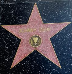 the star for johnny depp is shown on the hollywood walk of fame in los angeles