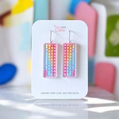 Keyboard earrings featuring a colorful pastel design, perfect for quirky gamers and tech enthusiasts who love something fun and weird. These cute acrylic dangle earrings are shaped like a keyboard with vibrant pastel colors, adding a playful and quirky touch to any outfit. Lightweight and comfortable, they're ideal for everyday wear or as a funny accessory for special occasions. A great gift idea for gamers or anyone who loves tech-themed, weird, and quirky jewelry.  Made with stainless steel findings for sensitive ears, available with two options: hooks or ball posts in gold tone or silver. Measuring approximately 1.75 to 2 inches depending on the findings chosen. Earrings come in a gift bag with a polishing cloth:) safely packaged in a shipping box.  Please contact me with any questions. Trendy Pastel Earrings For Gift, Fun Jewelry, Crazy Earrings, Kidcore Aesthetic, Tech Jewelry, Quirky Jewelry, Pastel Designs, Funny Accessories, Fun Earrings