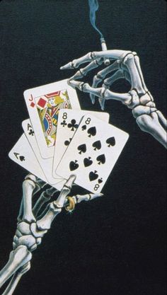 a skeleton holding playing cards in his hand