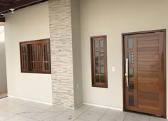 two wooden doors on the side of a building