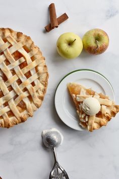 two pieces of pie sitting on top of a white table