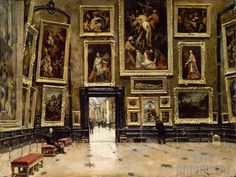 a large room with many paintings on the walls