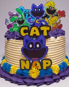 a cake decorated with cartoon characters and the words cat n o p is on top