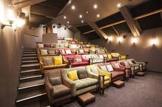 a row of chairs sitting next to each other on top of a carpeted floor