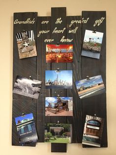 a wooden wall hanging with pictures and words on it, along with postcards attached to the board