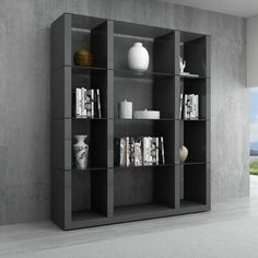 a book shelf with books and vases on it next to a large open window