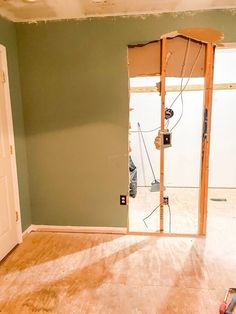 an empty room is being remodeled with wood flooring and walls in the process of remodeling