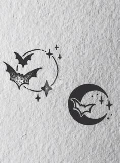 two bats flying over the moon and stars