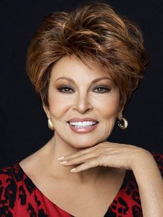 Fanfare by Raquel Welch is a short and sophisticated heat-friendly synthetic wig style. Featuring Tru2life® heat-friendly synthetic hair and a Sheer Indulgence lace front monofilament top gives you limitless styling options. Features include velvet ear tabs, a velvet nape, and an extended nape for added coverage. This classic short wig for women has the most versatile hair ever; create a whole new you in a flash! SPECIAL FEATURES Memory Cap II - A memory cap that actually memorizes the shape of