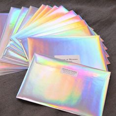 holographic envelopes are lined up on a table