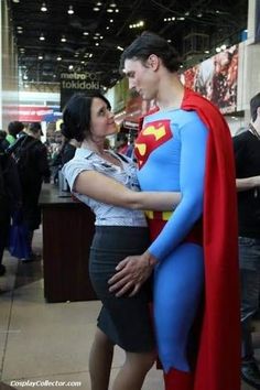 a man and woman dressed up as superman and supergirl standing next to each other