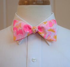 Men's Bow Tie, Ooh La La neon pink and gold  print, wedding bow tie, groomsmen gift, groom bow tie, Kentucky Derby bow tie, prom tieCatch some eyes in this vivid  bow tie in kir royale Ooh La La print in shades of neon pink and sunshine gold on a blush pink background with white accents. Adjustable in both pre-tied and self-tie version between 14" - 19.5". Pre-tied version has the hook and slider visible at the back but can still be tied and un-tied. The self-tie version has a hidden internal si Wedding Bow Tie Groomsmen, Groom Bow Tie, Bow Tie Groomsmen, Blush Pink Background, Gold Bow Tie, Groom Bowtie, Formal Tie, Wedding Bow Tie, Pink Bow Tie