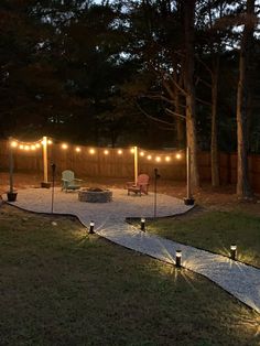 an outdoor patio with lights strung around it