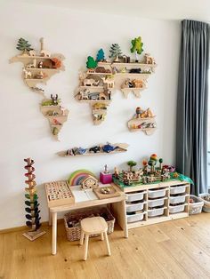 a child's playroom with wooden shelves and toys