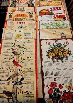 several calendars with birds and flowers on them are lined up in rows next to each other