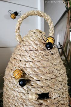 a straw bag with two bees on it