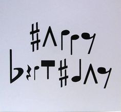 a piece of paper with the words happy birthday written in black and white on it