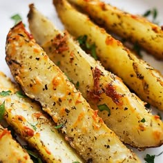 grilled potatoes with herbs and seasoning on a white plate