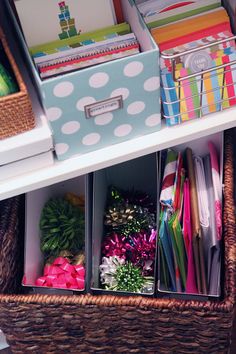 the drawers are filled with many different types of stationery and office supplies in baskets