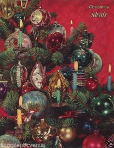 a christmas tree decorated with ornaments and candles