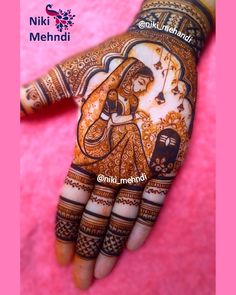 the hand is decorated with henna designs