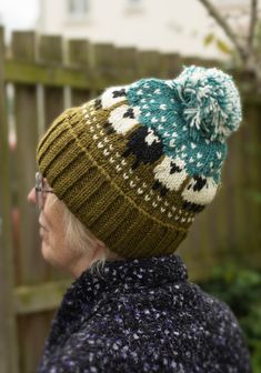 an older woman wearing a knitted hat