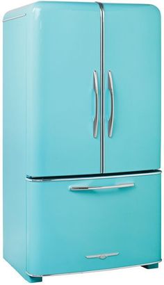 a blue refrigerator freezer sitting on top of a white floor next to a wall