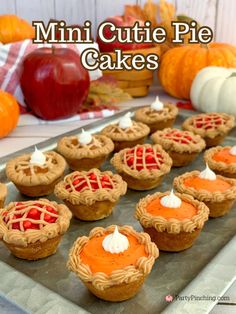 mini cutie pies on a tray with apples and pumpkins in the background