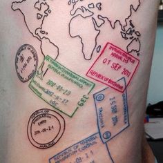 a man's tattoo with stamps on his stomach and world map in the background