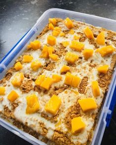 a plastic container filled with food on top of a table