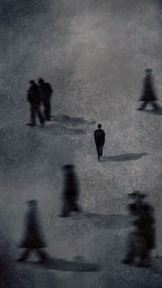 a group of people walking across a field in the foggy day with black and white photo