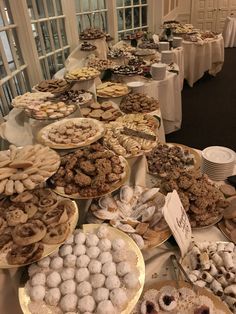 a table filled with lots of different types of pastries