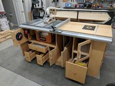 a workbench with many drawers and tools in it