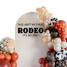 balloons are arranged around a headstone for rodeo