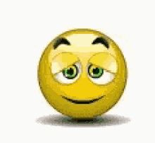 a yellow smiley face with green eyes